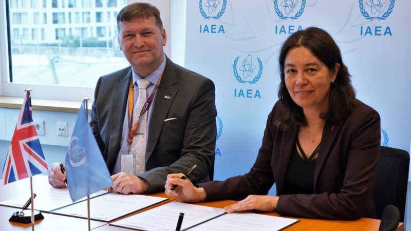 Representatives of IAEA and NTS signing a nuclear security agreement at the IAEA' headquarters in Vienna